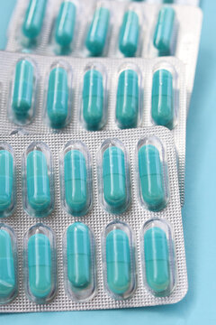 Blue capsules of Doxycycline in blister packs.