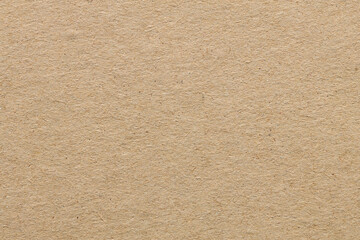 Fototapeta premium Rough beige cardboard paper texture background with natural fiber grain and copy space