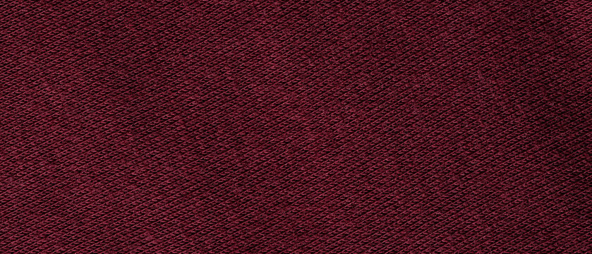 Dark burgundy woven fabric texture background with diagonal pattern close-up