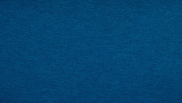 Dark blue paper texture background with subtle grain for design and copy space