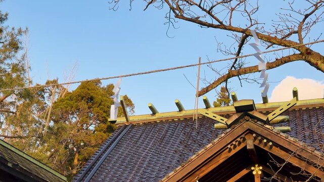Traditional Shinto Shrine Roof with Shimenawa Rope and Shide Streamers
