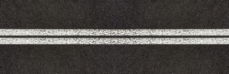 Fototapeta premium Lignes blanches doubles sur asphalte 