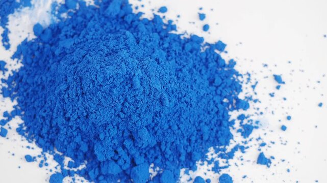 bright blue nila powder on a white background 