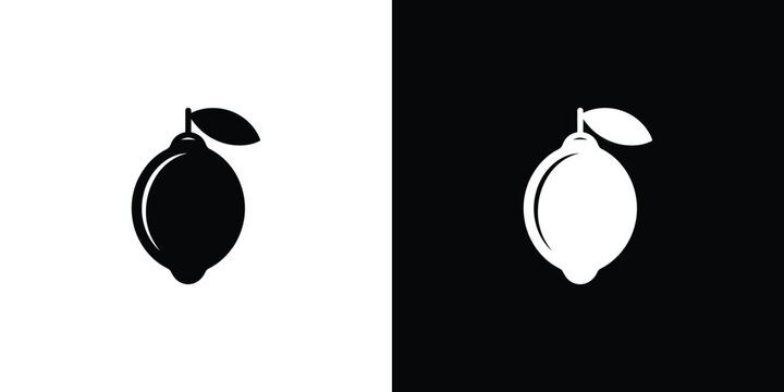Black and white lemons on split color background fruit