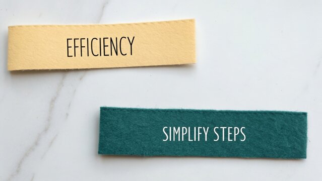 Colorful paper cutouts with text on marble background showcasing concepts of efficiency and simplification in design