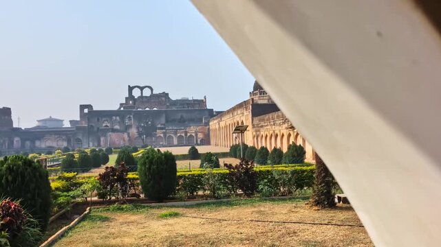 Reveal shot of Tarkash Mahal with Solah Khambah masjid and fort garden at bidar, karnataka, india. day time, slight pan shot, 4k.