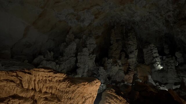 Wide angle reveal and look around the interior of Kong Lor cave in Laos