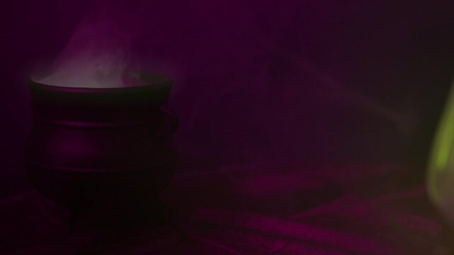 Halloween Witches Cauldron brewing smokey potion with space for title graphic
