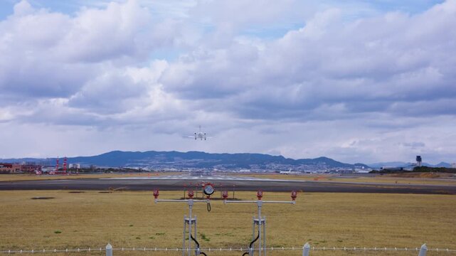 Small Twin Turbine Jet Landing at Atami Airport, Tilt Establishing Shot of Osaka