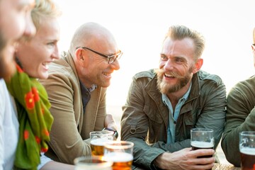 Friends enjoying drinks outdoors.
