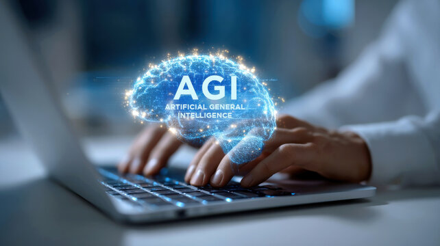 AGI artificial general intelligence hologram above hands typing on laptop keyboard conveying futuristic innovation and focused creativity
