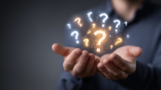 Hands cradle floating question marks, representing confusion or seeking answers