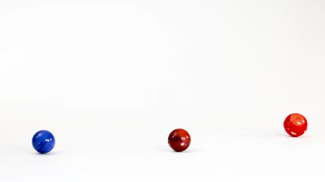 Colorful Marbles and Earth Ball Toy Bouncing on White Background