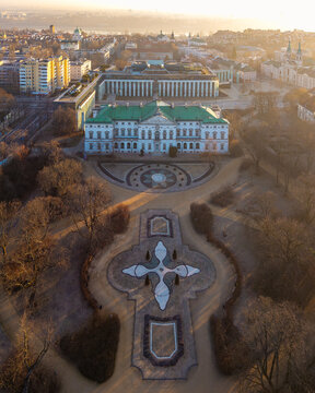 Aerial view of the baroque Krasinski Palace and its formal geometric gardens during golden hour in Warsaw, Masovian Voivodeship, Poland.