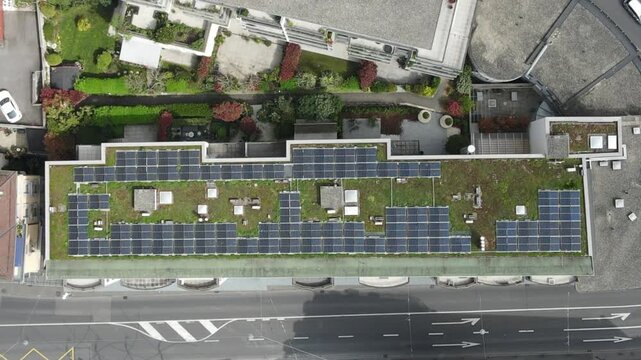 Aerial Top View of Green Roof with Solar Panels on Modern Urban Building