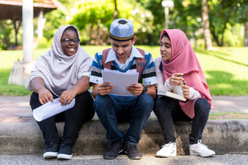 Fototapeta premium Diverse students studying outdoors together