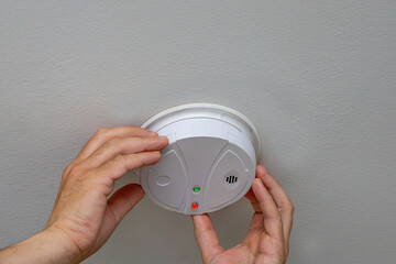 Installing Smoke Detector On Ceiling © JackCA