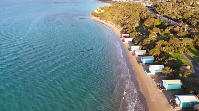 Aerial view of colorful beach huts on morning shoreline of Mount Martha Melbourne Australia.