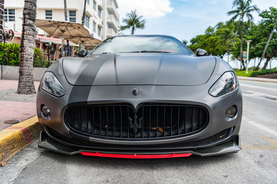 Miami, Florida, USA - July 27, 2025: Luxury gran Turismo car Maserati. Car coupe Maserati parked outdoor. Black matte car, front view. Maserati Gran Turismo 2015 coupe car.