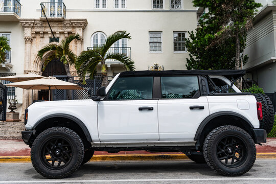 Miami, Florida, USA - July 27, 2025: Luxury SUV car Ford Bronco. Car Ford Bronco parked outdoor. White SUV car, side view. Ford Bronco 2022 SUV car
