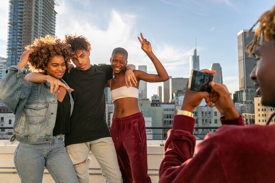 Friends enjoying rooftop photoshoot photo
