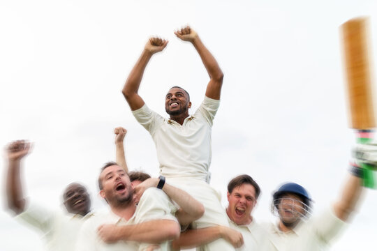 Cricket team celebrating victory joyfully
