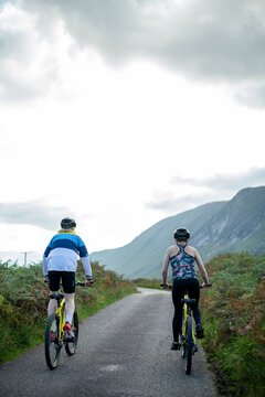 Cyclists exploring scenic mountain road