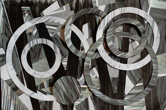 Abstract Collage of Distorted Glitch Rings and Geometric Paper Shapes