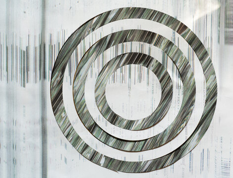 Concentric Abstract Glitch Rings on White Textured Background
