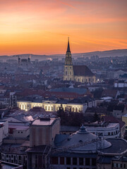 Naklejka premium Aerial sunrise panorama of Cluj city skyline, Transylvania, Romania