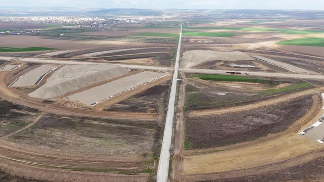 Top-down drone view of a large highway interchange under construction near Pașcani, Romania, part of the future A7 and A8 motorways