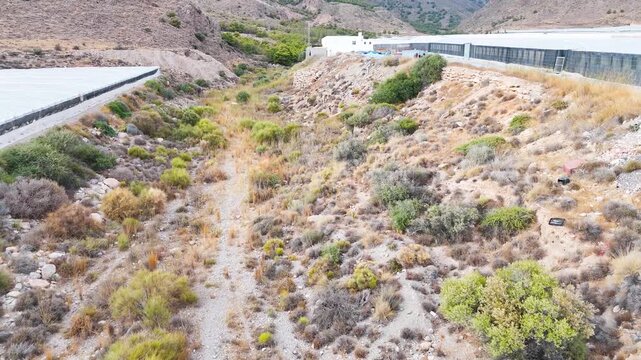 industry border nature dry desert agriculture modern equipment plastic sea limit greenhouse invernaderos plant vegetation industrial building - Andalusia, Spain - 2025
