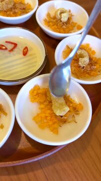 Adding Fish Sauce to Vietnamese Banh Beo Steamed Rice Cakes