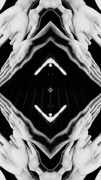 A mesmerising kaleidoscopic style abstract background featuring posed spinning hands in a looping pattern.
