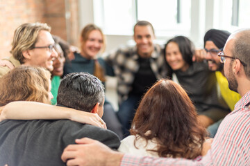 Diverse group hugging joyfully