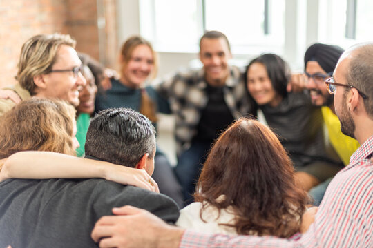 Diverse group hugging joyfully