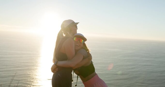 People, hiking and high five by ocean with hug, sunshine or check smart watch for fitness achievement. Flare, friends and celebration by sea outdoor with tech, wellness or embrace for hiker milestone