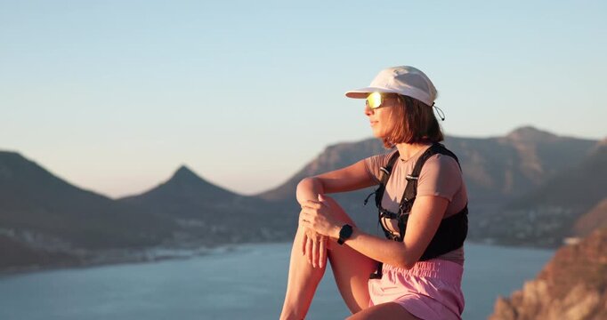 Hiking, thinking or woman with sunglasses on mountain, outdoor expedition break or view ocean for holiday. Reflection, space and person relax on cliff with shades, trekking adventure and daydream