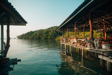 Authentic Overwater Wooden House and Floating Fishing Raft in Tropical Bay © artrachen