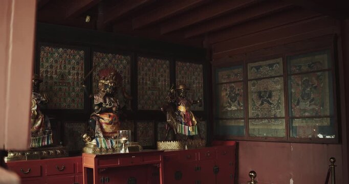 Guardian deity statues and thangka wall at Yonghe Lama Temple, Beijing