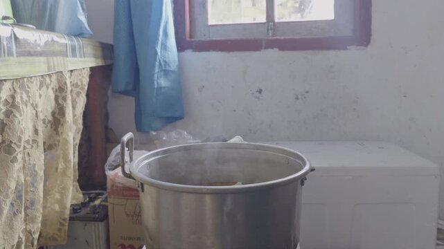 Adding Vegetables into Boiling Pot Cooking Soup in Home Kitchen