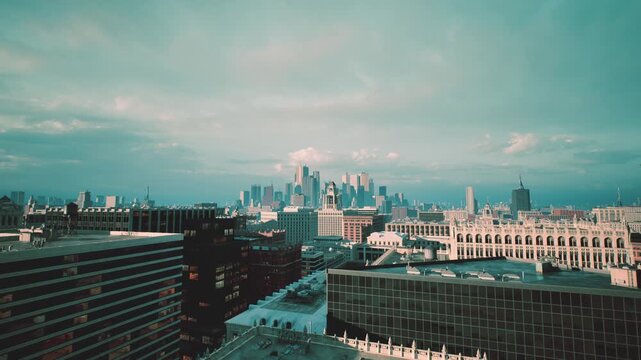 twilight city panorama over urban rooftops, soft light reveals brick facades, cranes on horizon, planner inspecting skyline for redevelopment, blueprint