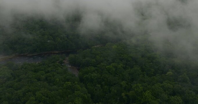 Low-hanging Clouds And Mist Over Churun River With Lush Green Forest At Canaima National Park In Venezuela. aerial shot