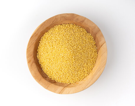 Raw millet grains pile isolated. Little yellow cereal, natural foxtail small seeds