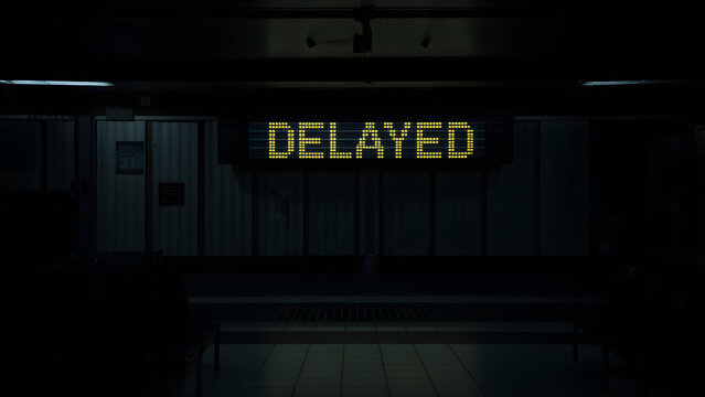 A delayed train sits in a dark station