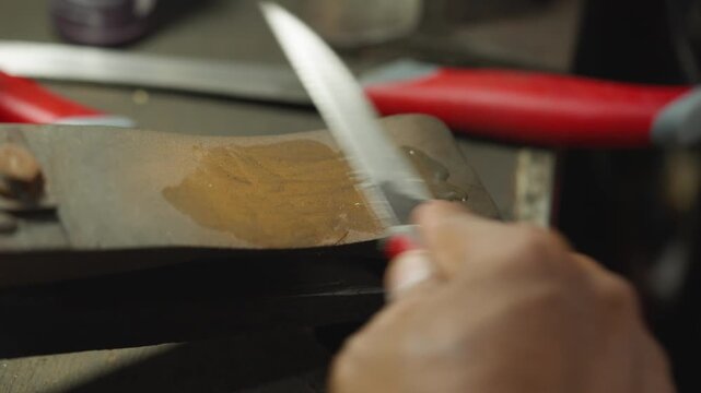 Manual knife sharpening process using sharpening stone by craftsman