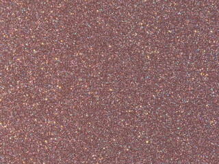 Fototapeta premium Macro texture of sparkling rose gold metallic car paint with iridescent flakes, abstract glitter background