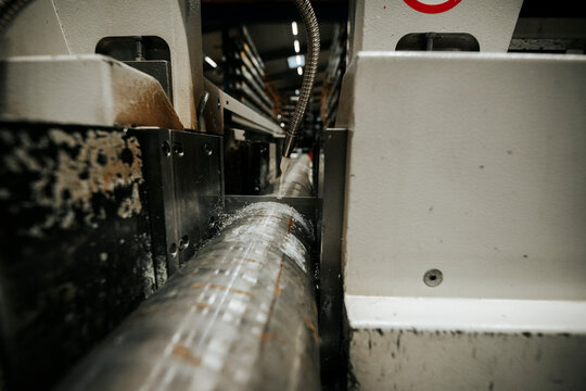 Industrial pipe bending machine close-up in metal fabrication factory