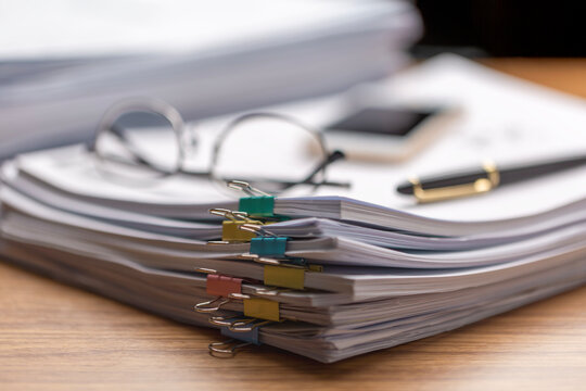 Pile of paperwork on office desk, Messy office workplace, Piles of papers, documents, numerous tasks waiting to be completed , chaotic array of ideas.