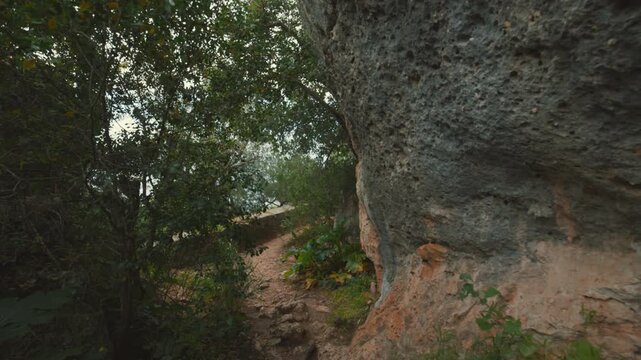 First person view walking on a narrow mountain path